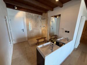a large bathroom with two sinks and a shower at Casa borgo Arias Lake View in Tremosine Sul Garda +48 photos