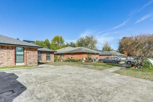 an empty driveway in front of a house at Tiger Town Retreat: Spacious 3-Home Retreat! in Baton Rouge