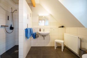 a bathroom with a sink and a shower at Dieboldshof in Neuried +51 photos