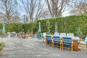 a patio with chairs and a table and umbrellas at The GG Mansion & Inn in Walla Walla