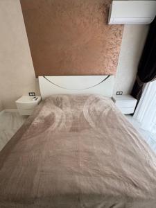 a bedroom with a bed and two toilets at Golden Era Relax in Odesa