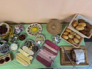 a table topped with lots of different types of food at Tauchbasis Stechlin in Stechlin