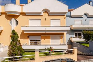 an image of a building with a balcony at Caldas Charm Getaway - Garden Terrace & Comfort in Caldas da Rainha