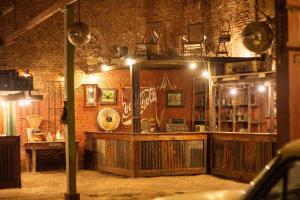 a bar in a room with a brick wall at casa montepio in San Antonio de Areco