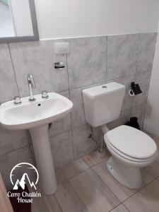 a bathroom with a toilet and a sink at Cerro Chaltén House - Deptos in El Chalten +13 photos