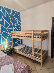 a bedroom with two bunk beds in a room at The One L'Aquila in LʼAquila