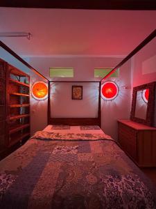 a bedroom with a bed with two lights on it at Surya Villa Holistic Stay Prenzlauer Berg in Berlin