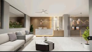 a living room with a couch and a table at Rest and Rise Inn in Bhīmavaram