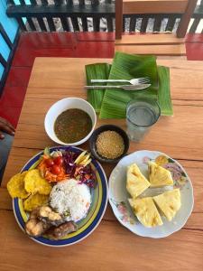 a table with two plates of food on a table at Tsamuna Ecolodge Macedonia in Macedonia