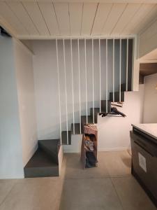 a room with a staircase in a house at Secret Courtyard Milano in Milan