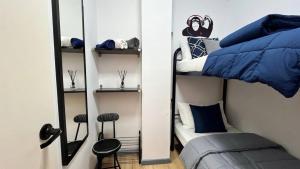 a bedroom with a bunk bed with a mirror at Estudio con piscina in Roses +16 photos