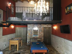 a room with a pool table and a balcony at Casa Regidor2 in Rábano