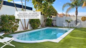a swimming pool in the yard of a house at Casa Alegra Pool & Spa in Gran Alacant