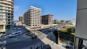 a view of a city street with traffic and buildings at Premium Lakeside Apartament Building Stefan in Mamaia