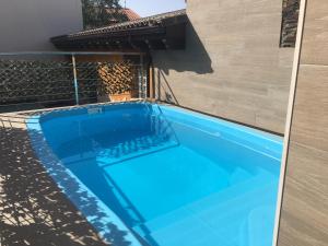 a swimming pool with blue water in a house at Casa Regidor2 in Rábano