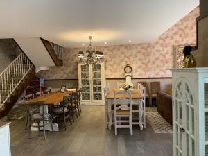 a dining room with a table and chairs and a staircase at Casa Regidor2 in Rábano