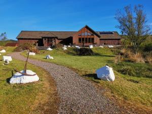 a house with a gravel road in front of a building at The Gather - Tarbert Argyll in Tarbert +5 photos