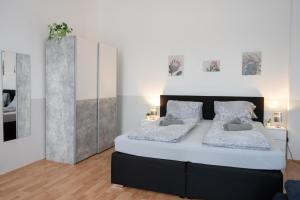 a bedroom with two beds and a large mirror at Paky Appartements 00210 in Vienna