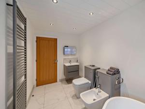a bathroom with a toilet and a sink at 3 Bed in Carlisle oc-94673 in Longtown +16 photos