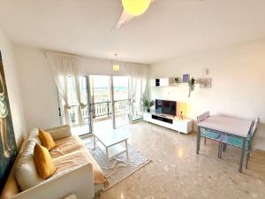 a living room with a couch and a table at Latchi Premium View in Lachi