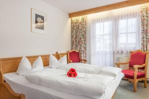 Postel nebo postele na pokoji v ubytování Hotel Garni Hanslerhof " Urlaub am Bauernhof "
