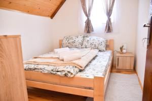 a bed in a room with a window at Villa Boris in Junčev Do