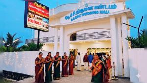 a group of women standing in front of a building at achi gest house in Mulliyavalai