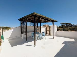 a gazebo on the roof of a house at Domus Caelestia in Anzio