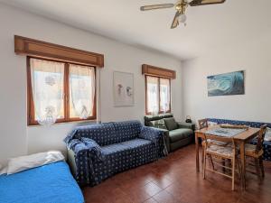 a living room with a couch and a table at Domus Caelestia in Anzio
