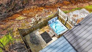 an overhead view of a swimming pool in a house at Brookside Cabin in South Bloomingville