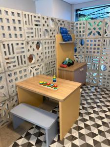 a room with a table with a toy on it at Hotel Negrini in Balneário Camboriú +46 photos