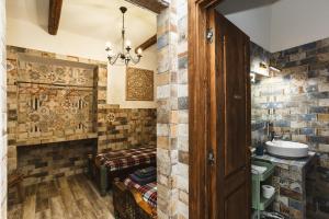 a bathroom with a brick wall and a sink at AQUILA D'ORO TRIESTE in Trieste +138 photos