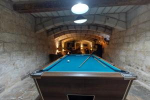 a room with a pool table in a building at Palazzo Pisani & Spa Malta in Żabbar