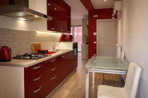 a kitchen with a stove and a counter top at Arvén Crimson in Marghera