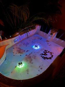 a jacuzzi tub with lights in a room at Tiny Love Room in Ao Nang Beach