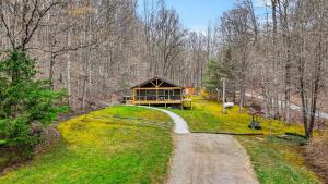 a house on a hill with a road leading to it at Lane's End in Laurelville