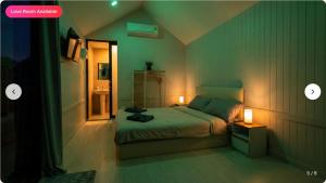 a bedroom with a bed and a bathroom with lights at Tiny Love Room in Ao Nang Beach
