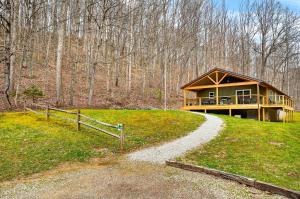 a house on a hill with a path leading to it at Lane's End in Laurelville