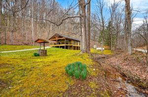 a large house in the middle of a forest at Lane's End in Laurelville