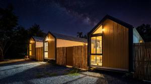 a row of cottages at night at Tiny Love Room in Ao Nang Beach