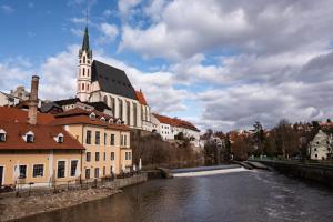 a city with a river and a church at Old Town Living Studio in Český Krumlov