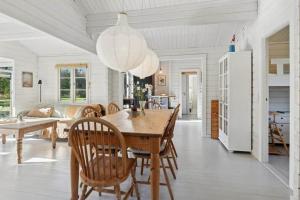 a kitchen and dining room with a table and chairs at TV1721-Jerup-Engsigen-12 in Bratten Strand +17 photos