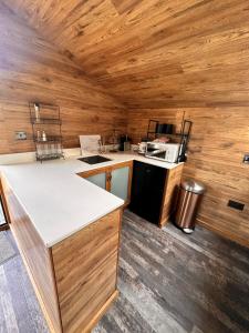 a kitchen with wooden walls and a counter top at The Loft in Burnley +14 photos