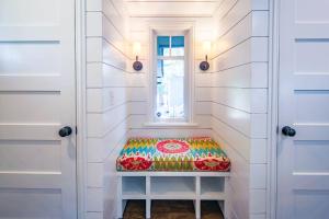 a bench in a room with a window at Fiddlers Hideaway in Kiawah Island