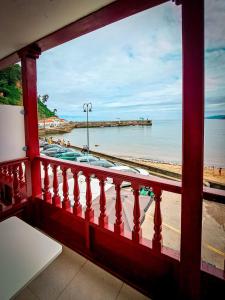 a view of the beach from a balcony at Hotel Imperial in Tazones