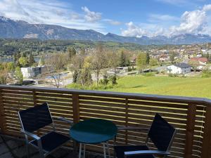 a balcony with chairs and a view of mountains at Ferienwohnung Amseltraum in Seeboden