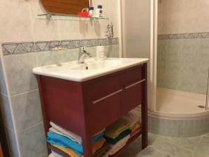 a bathroom with a sink and a shower at Chalupa 58 in Štiavnické Bane +9 photos