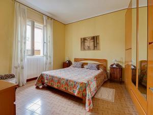 a bedroom with a bed and a window at IL TORRINO in Golasecca