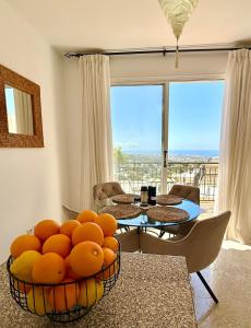 a living room with a table with oranges on it at Tala Panorama View in Tala