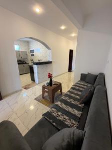 a living room with a couch and a kitchen at KR Hotel in Luxor